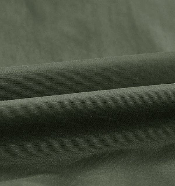 Olive green nylon fabric texture, ideal for crafting stylish, quick-dry, multi-pocket men's waistcoat.